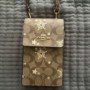Never before used coach Holliday purse